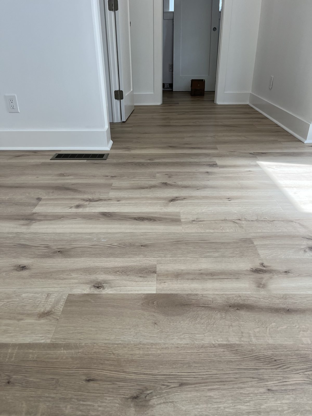 Grey luxury vinyl plank flooring installation